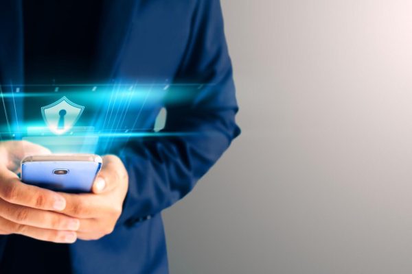 close-up-business-man-formal-blue-suit-use-hold-smart-phone-in-the-dark-and-copy-space-use-finger-print-unlock-smart-phone-security (2) (1)